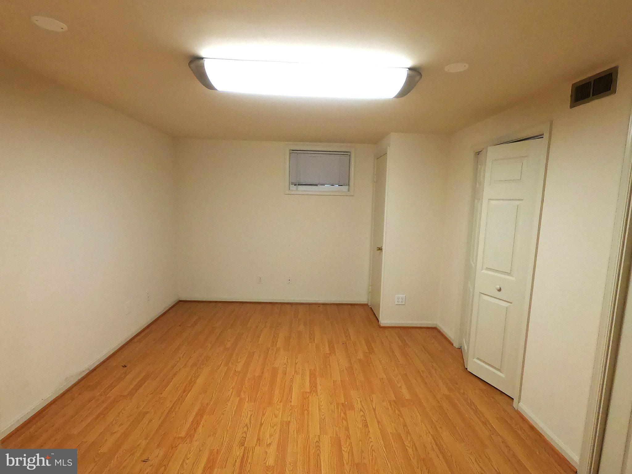 11806 Seven Locks Road Potomac, MD 20854 - Photo 8 of 8 Spacious room with warm wood floors.