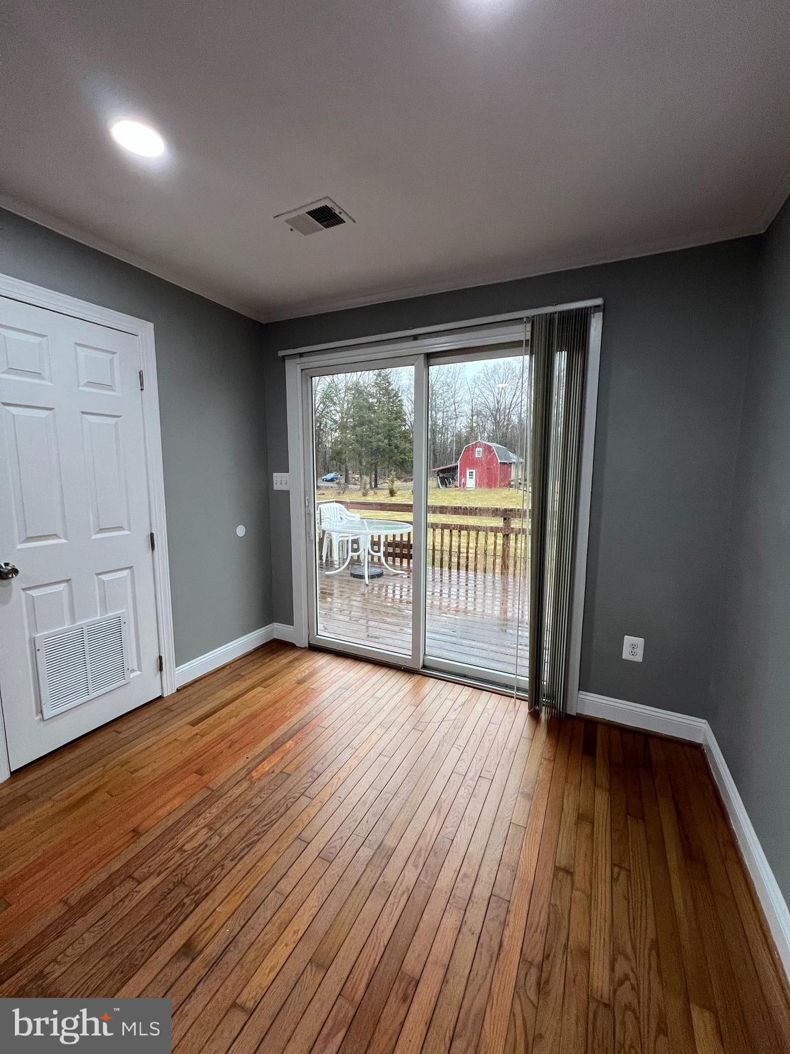 19956 Broad Run Drive Sterling, VA 20165 - Photo 12 of 24 wooden floor in an empty room with a window