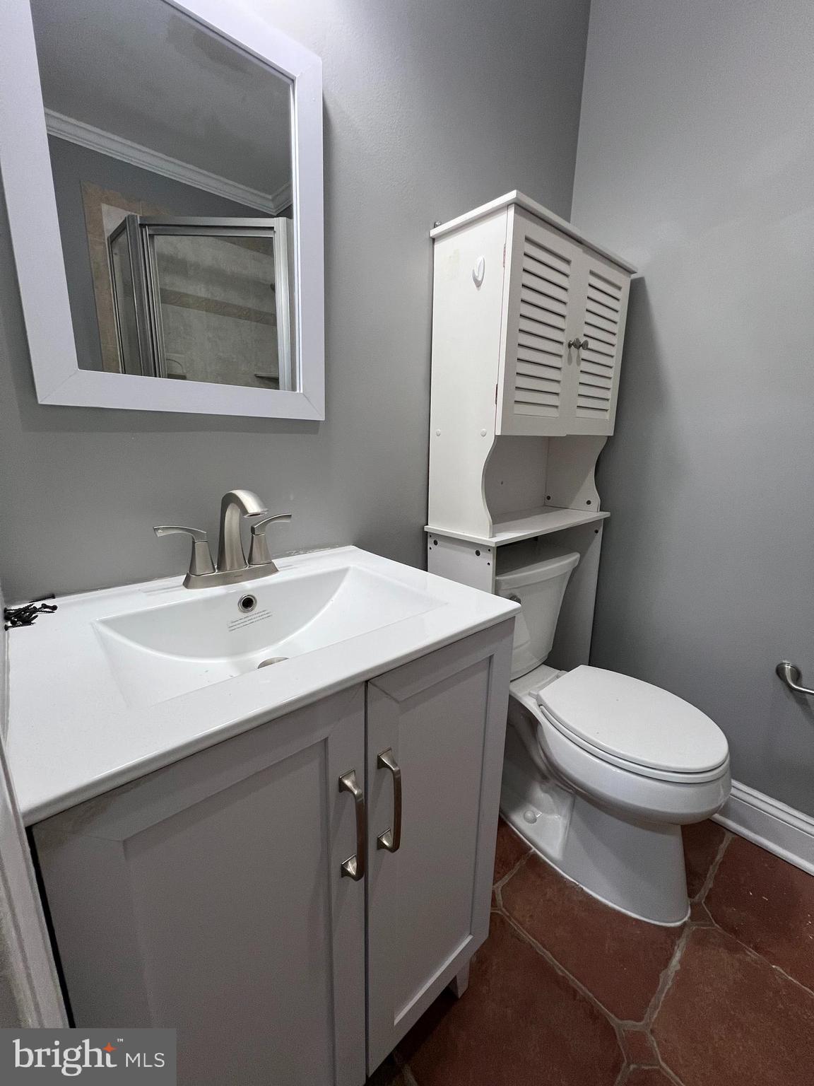 19956 Broad Run Drive Sterling, VA 20165 - Photo 14 of 24 a bathroom with a toilet sink and mirror