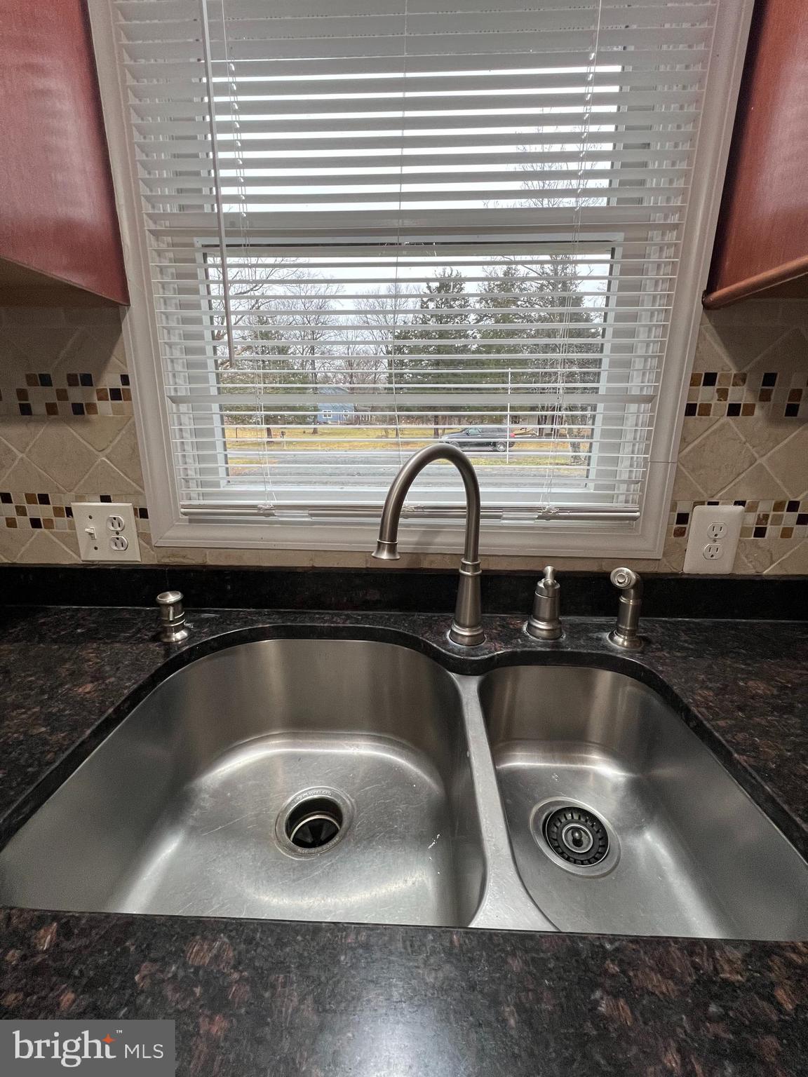 19956 Broad Run Drive Sterling, VA 20165 - Photo 8 of 24 a kitchen with a sink and a window