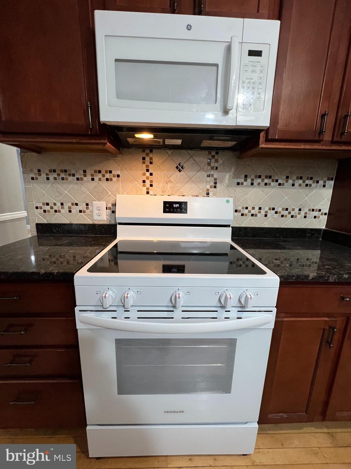 19956 Broad Run Drive Sterling, VA 20165 - Photo 9 of 24 a stove top oven sitting inside of a kitchen