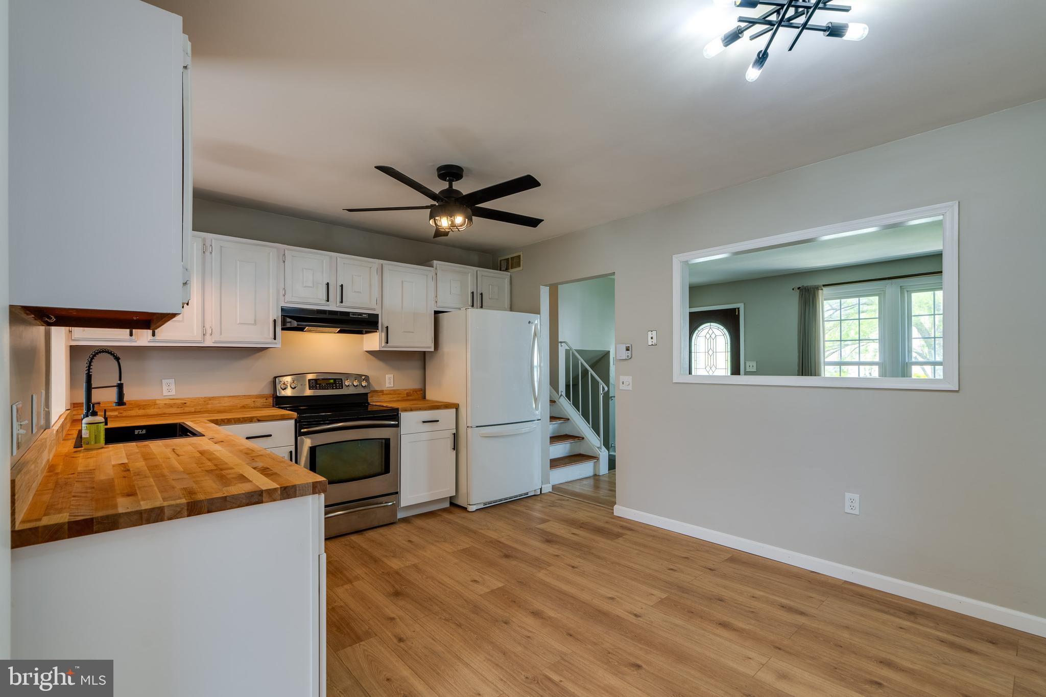 166 Pulte Road Lancaster, PA 17601 - Photo 15 of 41 a kitchen with stainless steel appliances kitchen island granite countertop a stove top oven a sink a counter space and cabinets