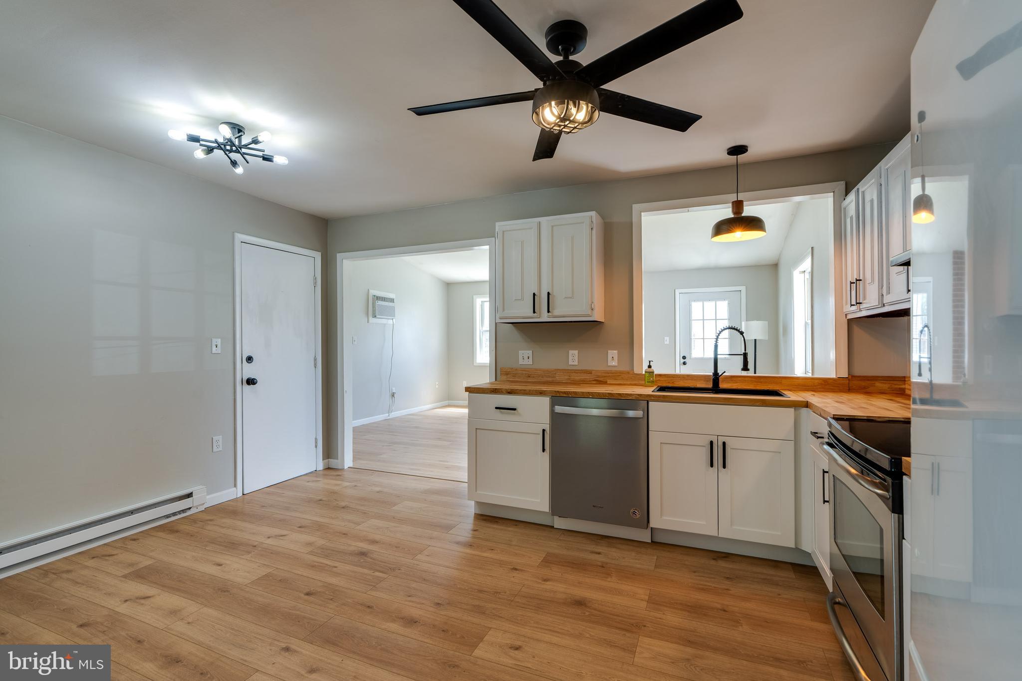 166 Pulte Road Lancaster, PA 17601 - Photo 16 of 41 a kitchen with a chandelier stainless steel appliances cabinets and a counter top space