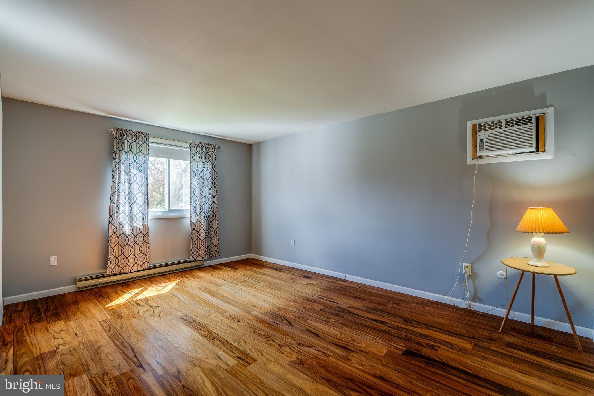 166 Pulte Road Lancaster, PA 17601 - Photo 25 of 41 a view of an empty room with window and wooden floor