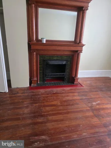 a view of fireplace and wooden floor