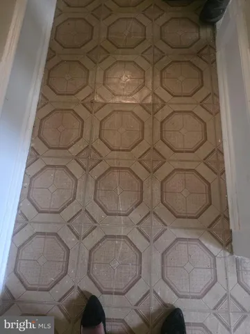 a bathroom with a toilet and a mirror