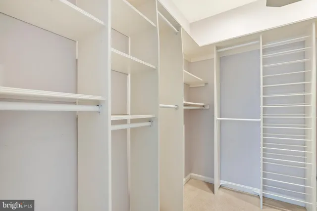 a view of an empty walk in closet