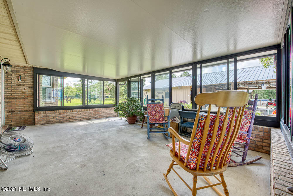 1241 D B Hicks Road Bryceville, FL 32009 - Photo 17 of 33 Enclosed Back Patio