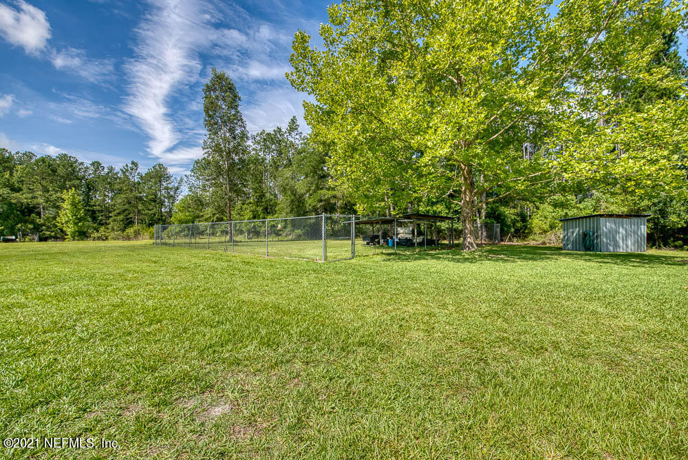 1241 D B Hicks Road Bryceville, FL 32009 - Photo 28 of 33 Fenced Area with Small Shed