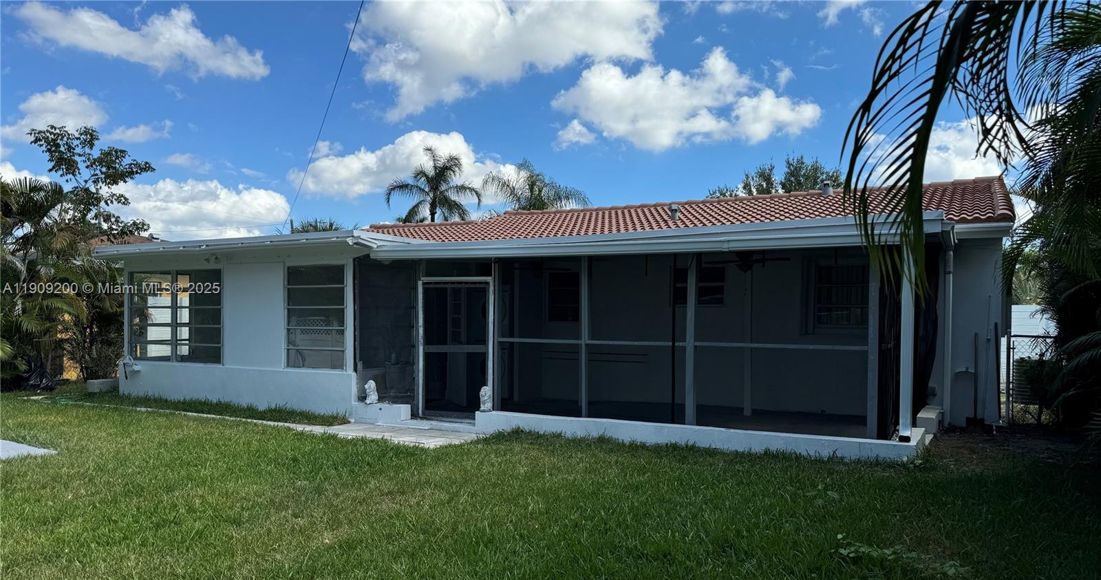 2400 North 57th Way Hollywood, FL 33021 - Photo 8 of 10 a view of a house with a large window and a yard