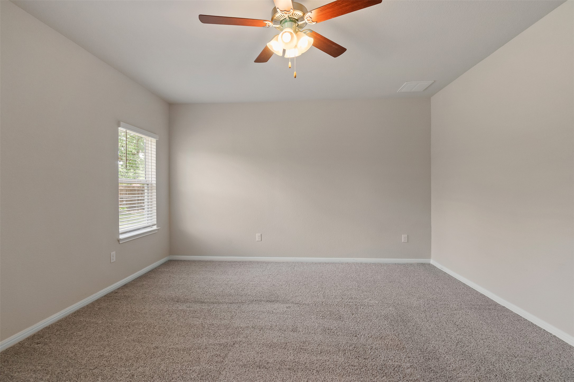 4125 Buffalo Ford Road Georgetown, TX 78628 - Photo 19 of 28 Spare room with carpet and a ceiling fan