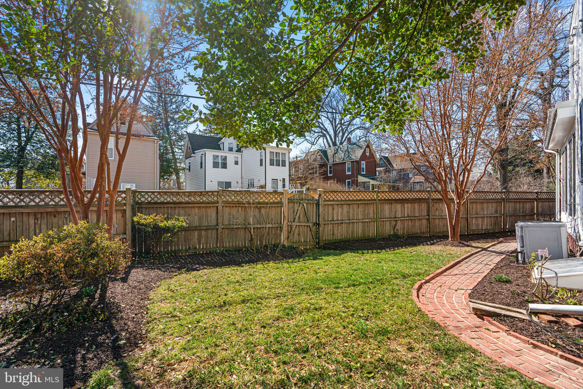 2 St Dunstans Garth Baltimore, MD 21212 - Photo 39 of 45 a view of a backyard with wooden fence and large trees