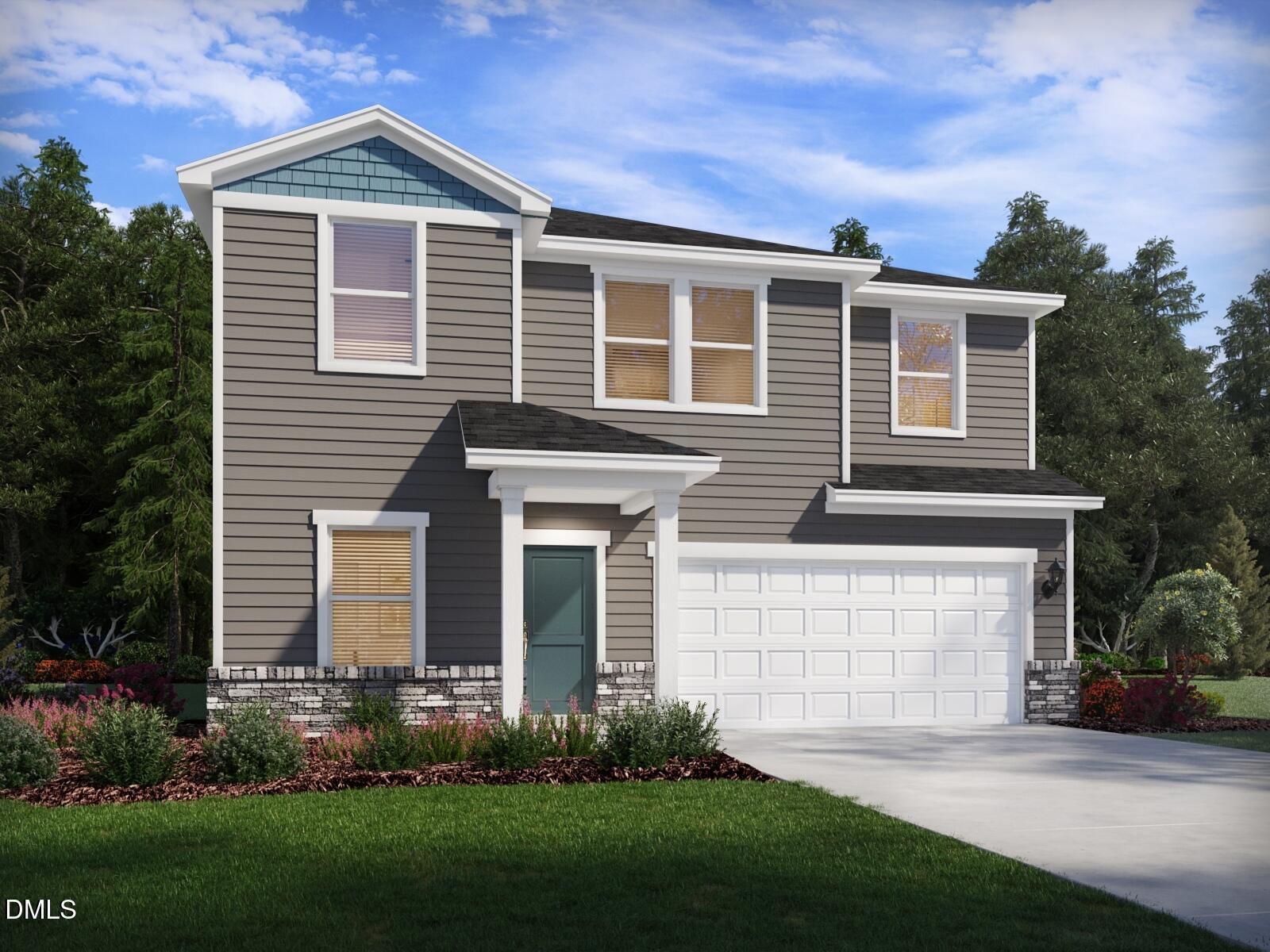 a front view of a house with a garden and plants