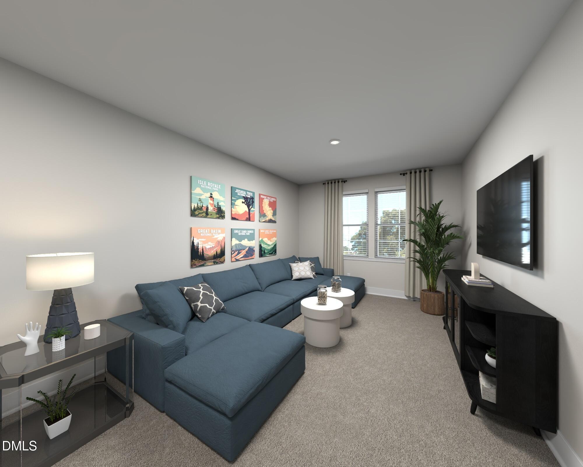 175 Field Sparrow Way Clayton, NC 27520 - Photo 7 of 13 a living room with furniture a flat screen tv and a fireplace