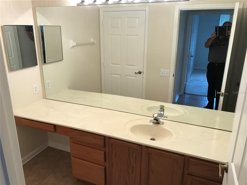 588 Brantley Terrace Way, Unit 303 Altamonte Springs, FL 32714 - Photo 12 of 24 a bathroom with a sink and a mirror