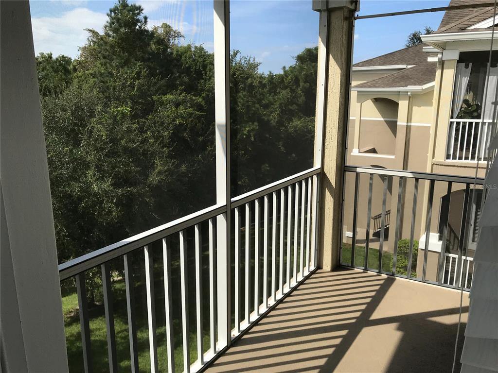 588 Brantley Terrace Way, Unit 303 Altamonte Springs, FL 32714 - Photo 16 of 24 a view of a balcony with wooden floor