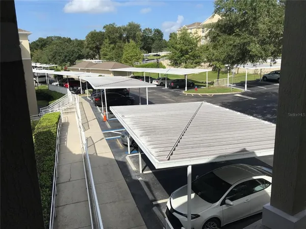 swimming pool view with a seating space