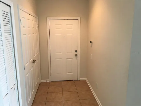 a view of a hallway with a door