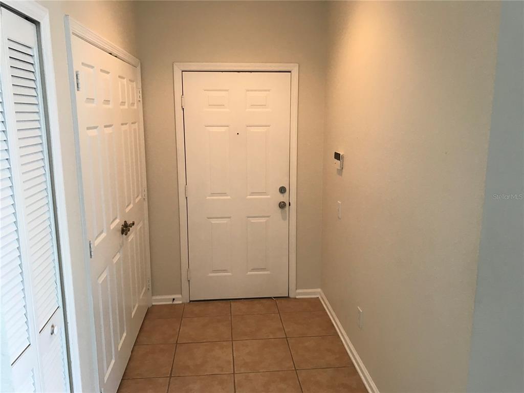 588 Brantley Terrace Way, Unit 303 Altamonte Springs, FL 32714 - Photo 3 of 24 a view of a hallway with a door