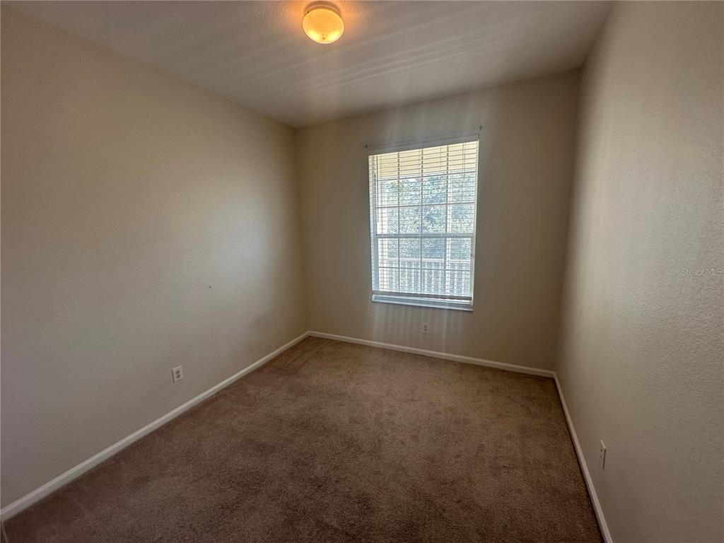 588 Brantley Terrace Way, Unit 303 Altamonte Springs, FL 32714 - Photo 8 of 24 an empty room with window