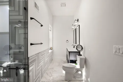 a bathroom with a sink and mirror