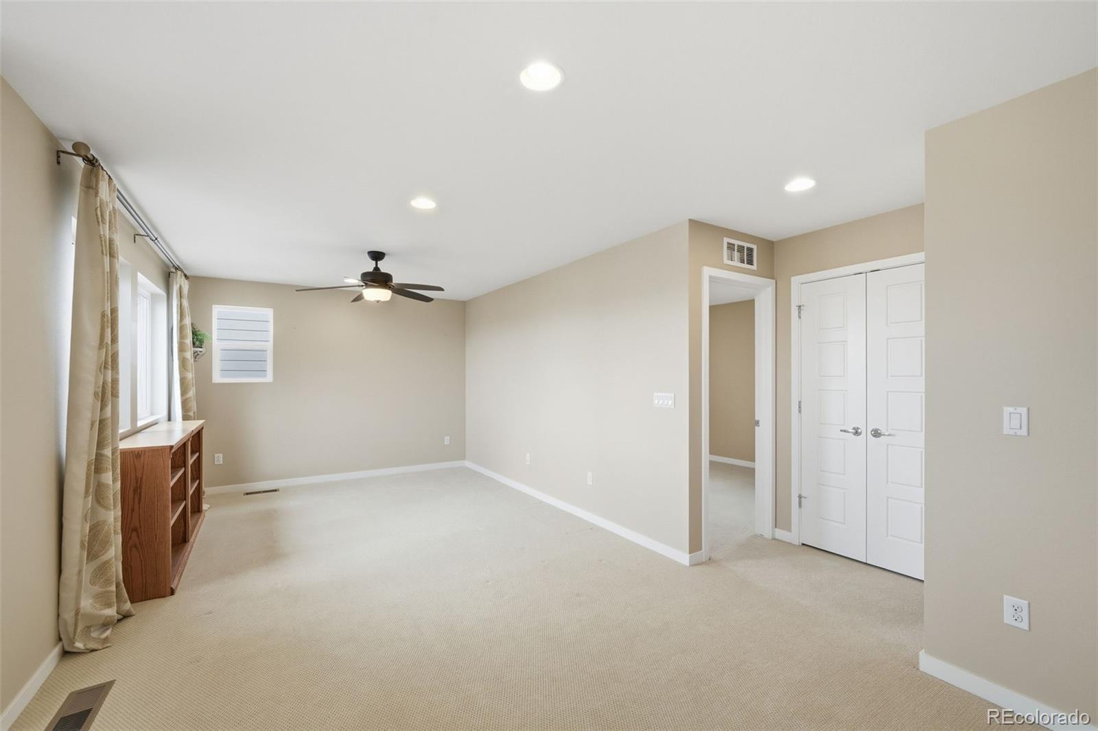 9602 Dunning Circle Highlands Ranch, CO 80126 - Photo 32 of 50 wooden floor in an empty room with a window