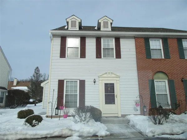 a front view of a house with yard
