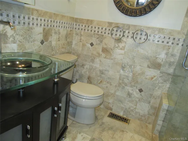 a bathroom with a toilet and a sink