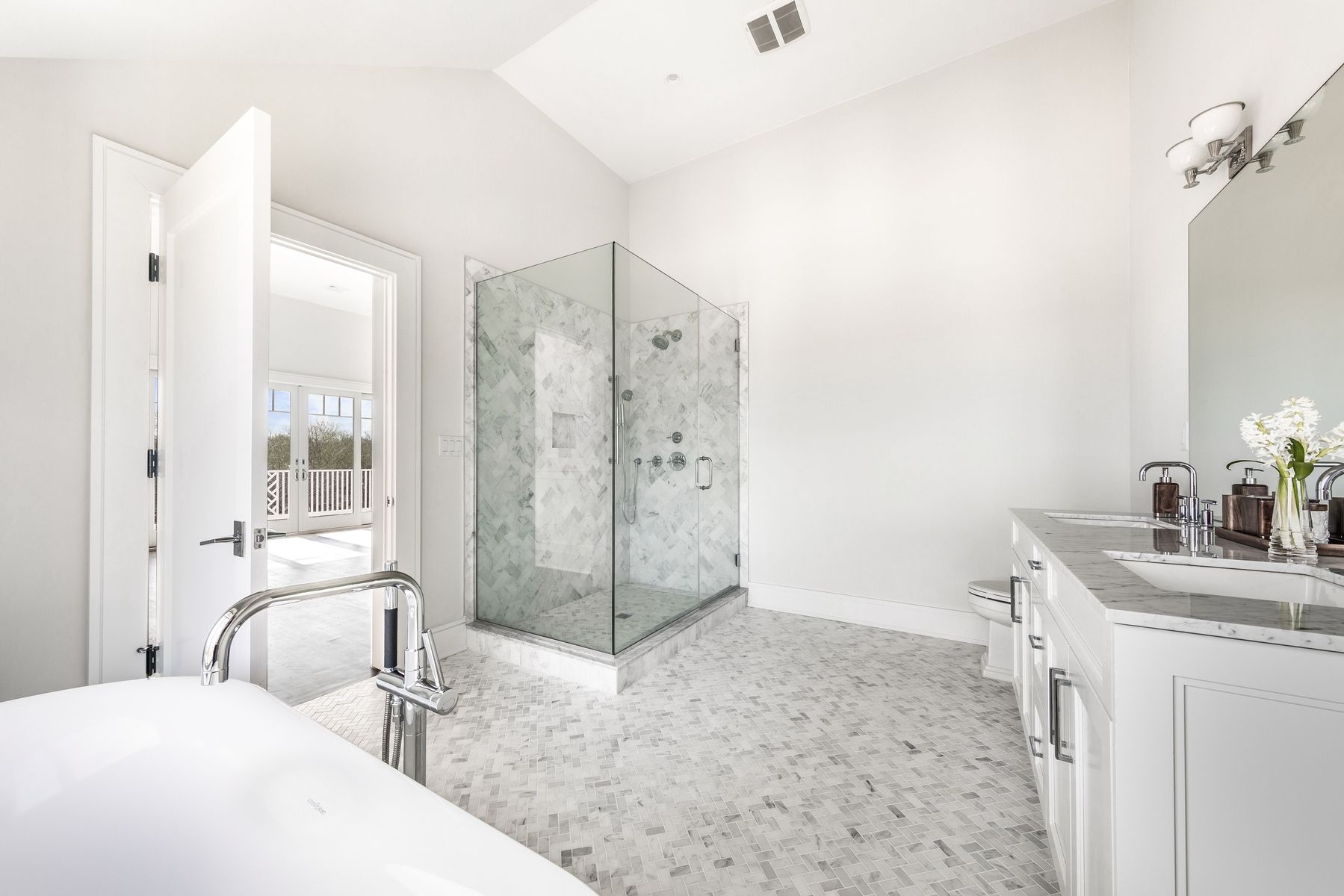 159 Middle Highway East Hampton, NY 11937 - Photo 12 of 18 a bathroom with a granite countertop sink mirror and shower