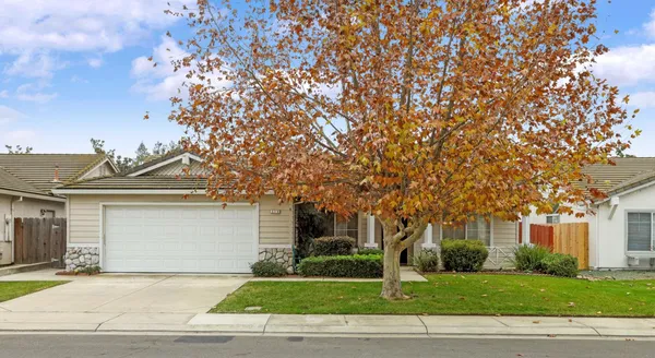 a front view of a house with a yard