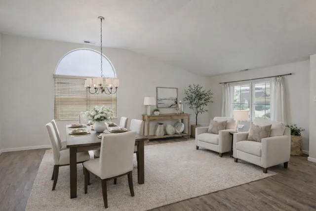 a view of a livingroom with furniture and a table