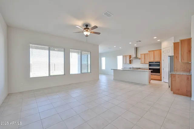 a view of kitchen with granite countertop cabinets and stainless steel appliances