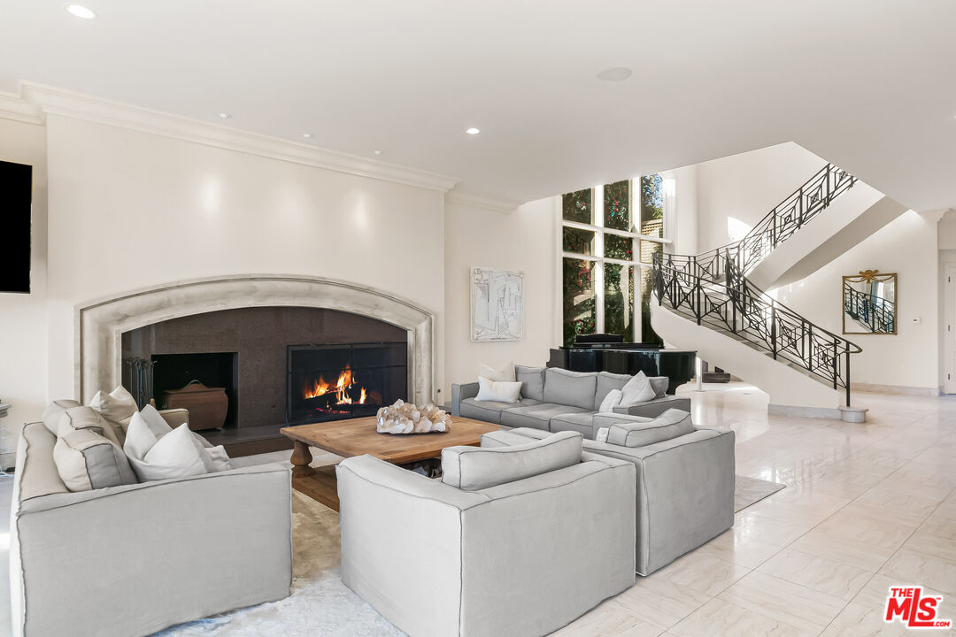 0 Broad Beach Road Malibu, CA 90265 - Photo 35 of 54 a living room with furniture and a fireplace