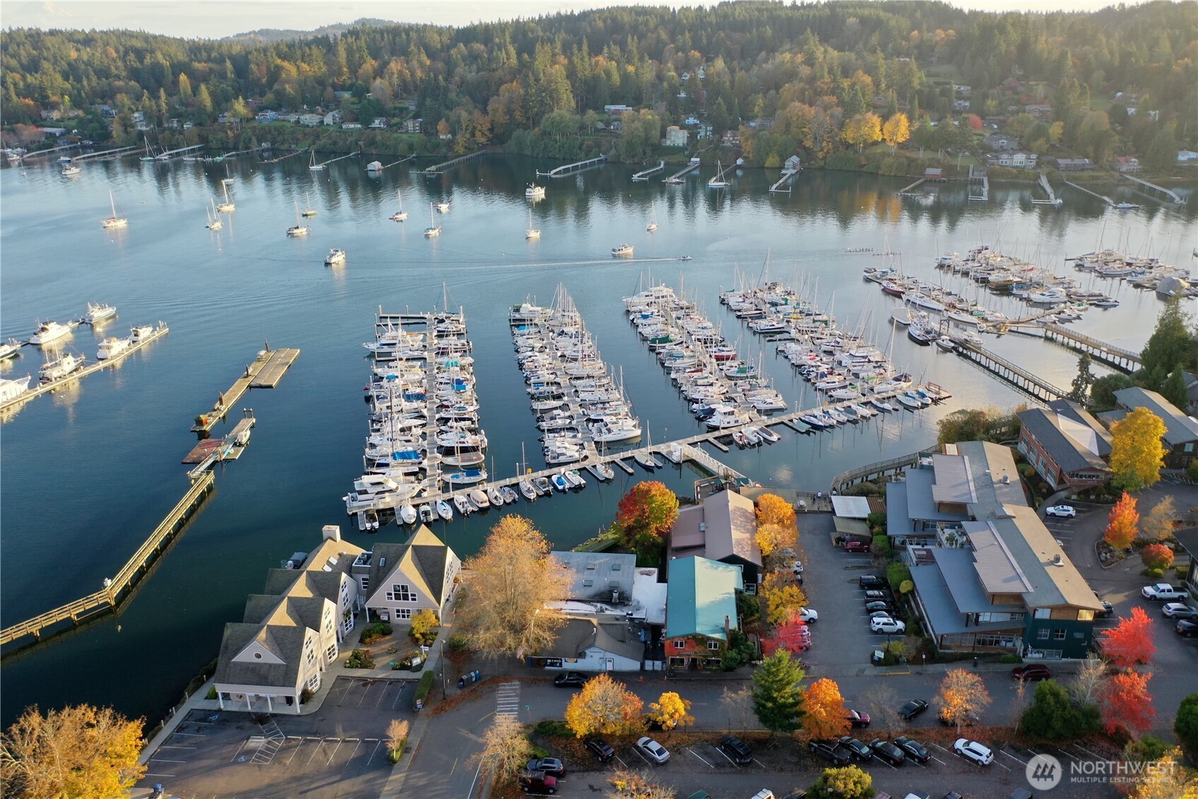 141 Parfitt Way Southwest, Unit A35 Bainbridge Island, WA 98110 - Photo 3 of 16 an aerial view of a house with a lake view