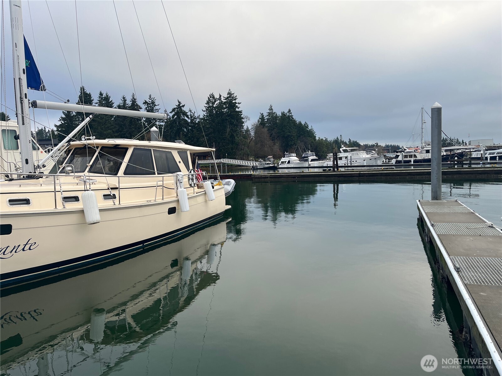 141 Parfitt Way Southwest, Unit A35 Bainbridge Island, WA 98110 - Photo 7 of 16 a view of a swimming pool with outdoor seating and lake view