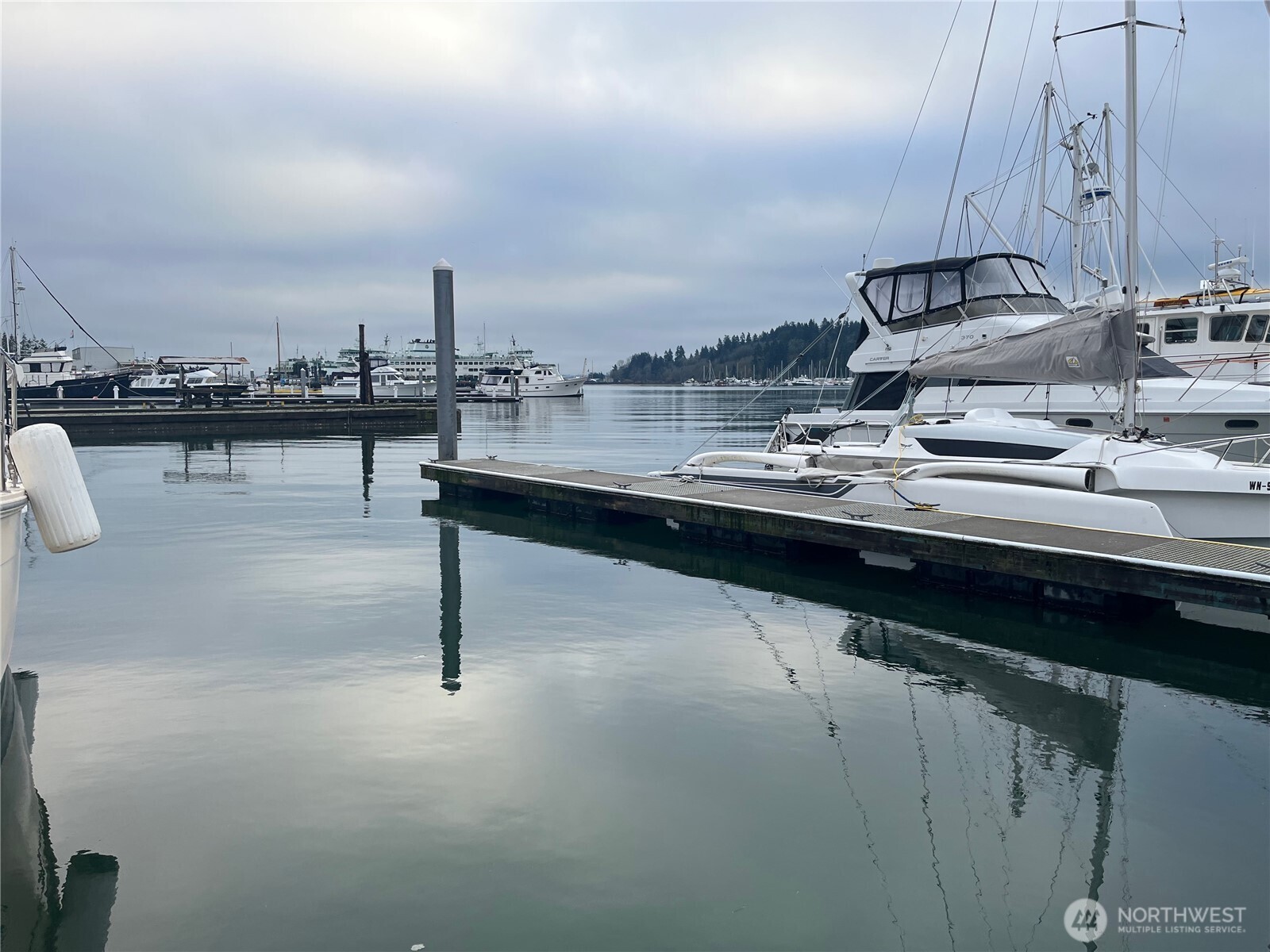 141 Parfitt Way Southwest, Unit A35 Bainbridge Island, WA 98110 - Photo 8 of 16 a kitchen with a sink and cabinets