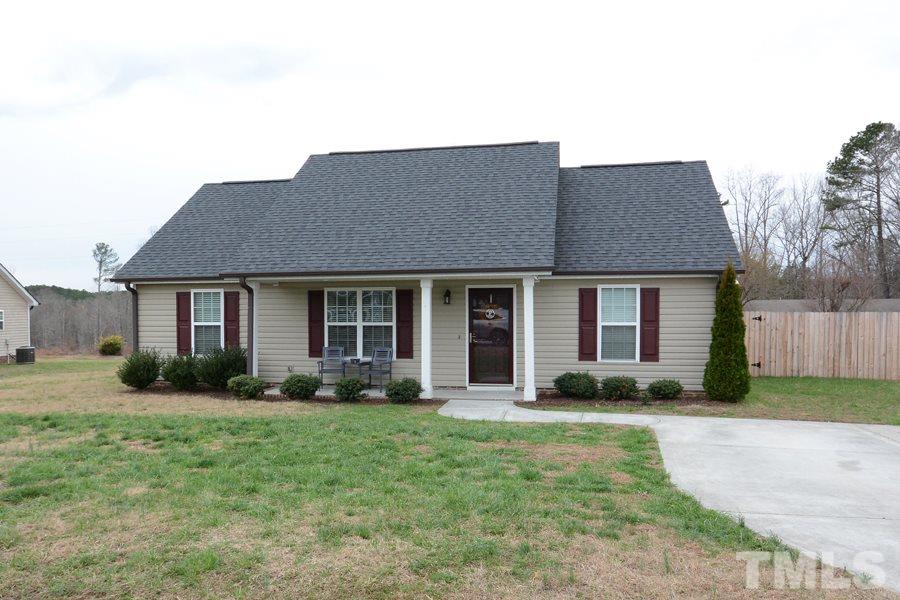220 Orkney Road Stem, NC 27581 - Photo 1 of 18 a front view of a house with garden