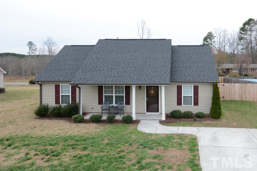 220 Orkney Road Stem, NC 27581 - Photo 2 of 18 a front view of a house with garden