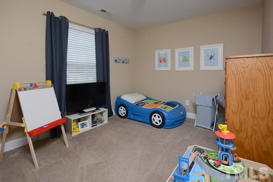 220 Orkney Road Stem, NC 27581 - Photo 13 of 18 a play room with furniture and a window