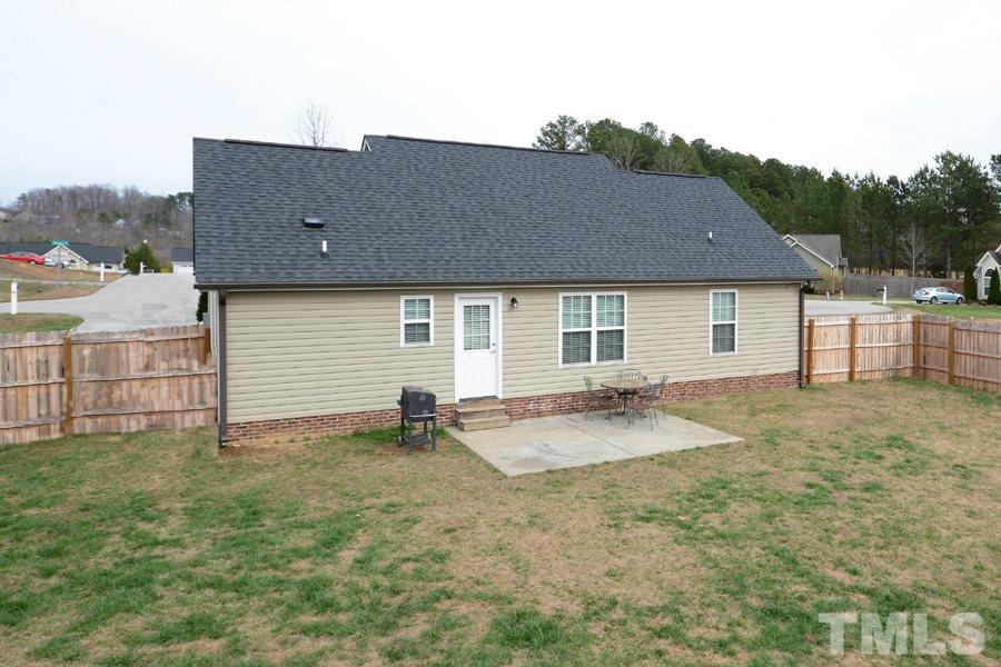 220 Orkney Road Stem, NC 27581 - Photo 16 of 18 a view of a house with backyard and sitting area