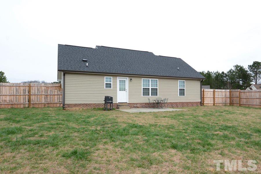 220 Orkney Road Stem, NC 27581 - Photo 17 of 18 a view of a house with a backyard