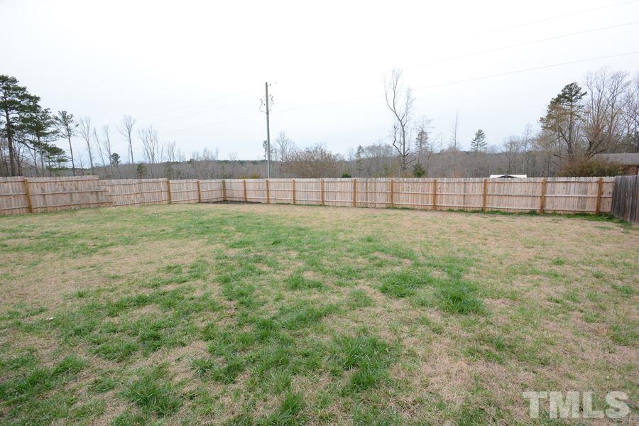 220 Orkney Road Stem, NC 27581 - Photo 18 of 18 a view of a yard with a fence