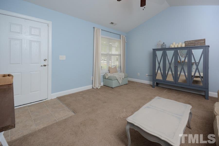 220 Orkney Road Stem, NC 27581 - Photo 3 of 18 a view of an empty room with window and cabinet