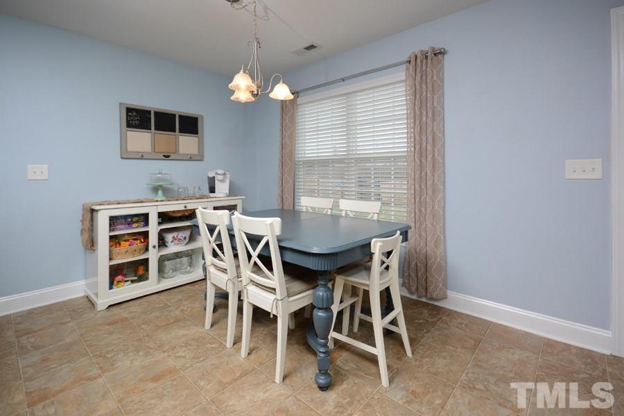 220 Orkney Road Stem, NC 27581 - Photo 9 of 18 a view of a dining room with furniture window and outside view