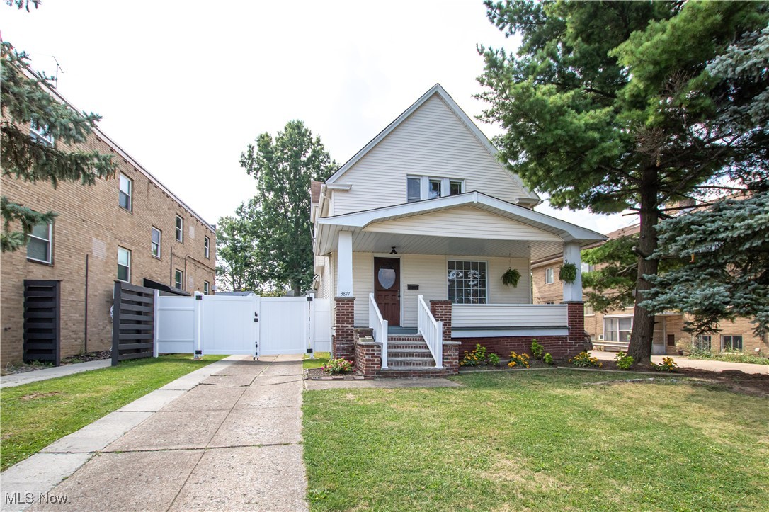 View of front of home with a gate and covered porch