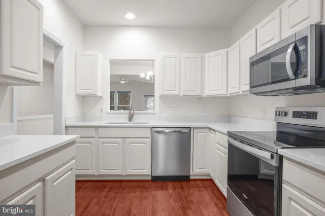 a spacious bathroom with double sink and a mirror