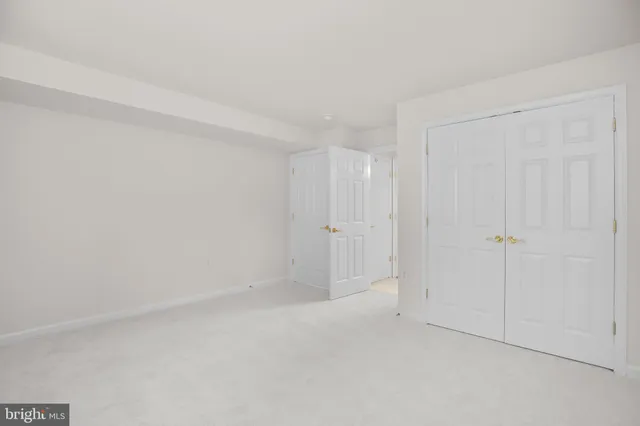 a front view of residential houses with yard and green space