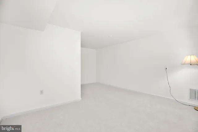 a large dining hall with stainless steel appliances granite countertop a stove and a dining table