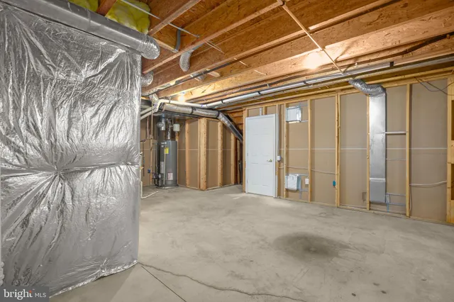 a view of a room with lots of furniture wooden floor and chandelier