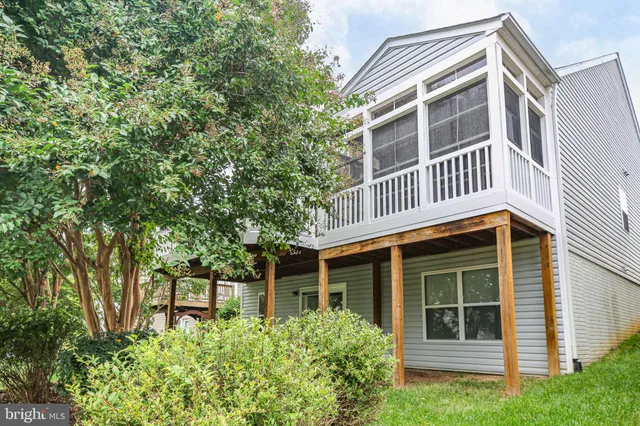 an empty room with a empty space and windows